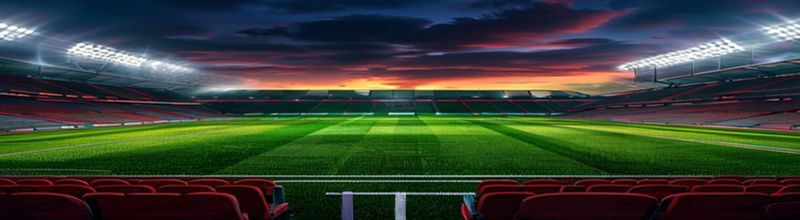 Champions League stadium at dusk with floodlights illuminating an empty striped pitch
